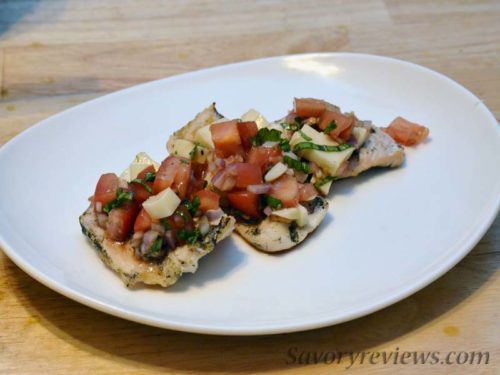 Top the chicken with the bruschetta topping