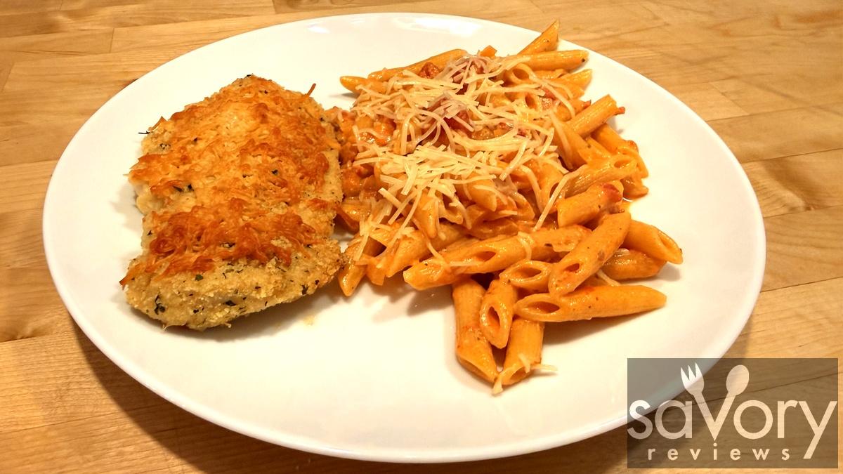 Crispy parmesan crusted chicken served with penne vodka sauce