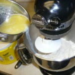 Pouring in the butter and milk