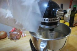 The wax paper makes pouring the flour into the mixer easy.
