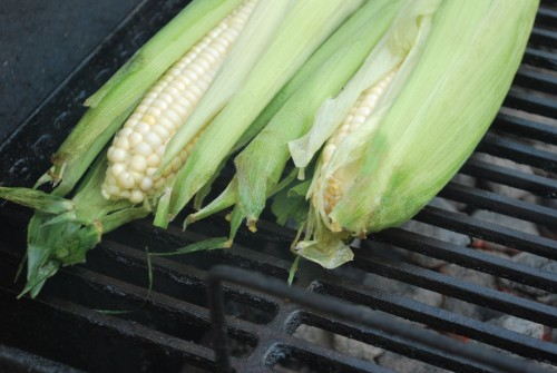I place the corn directly over the coals