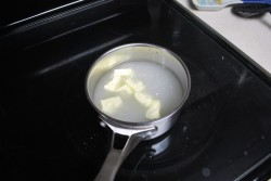 Add butter, salt, sugar and water to a pan
