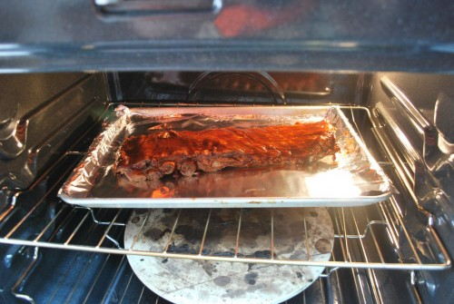 If you have your ribs any closer to the heating element it will burn the raised portions of the ribs before the rest gets a chance to carmelize.