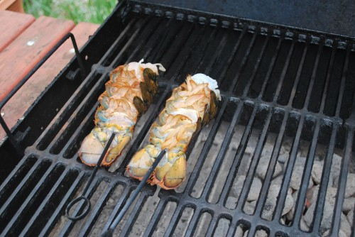 Place right on the edge of the hot and cold zones of the grill.