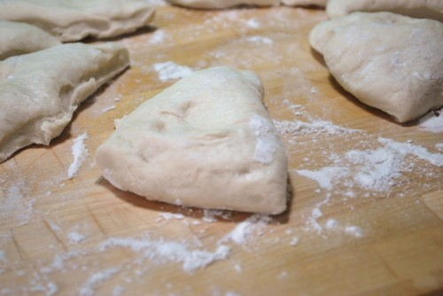 I find it is easiest to cut the dough into 8 pie shaped pieces.