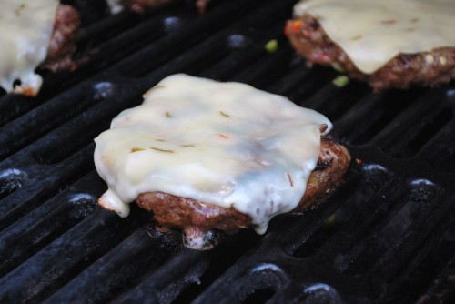 Closing the lid of the grill helps the cheese melt.