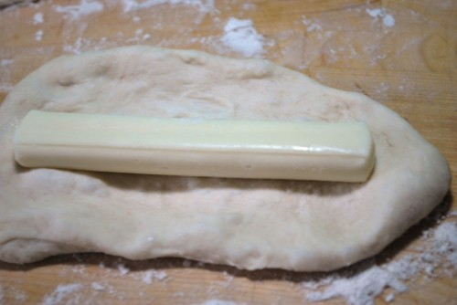Make sure to have the dough big enough to cover the cheese stick