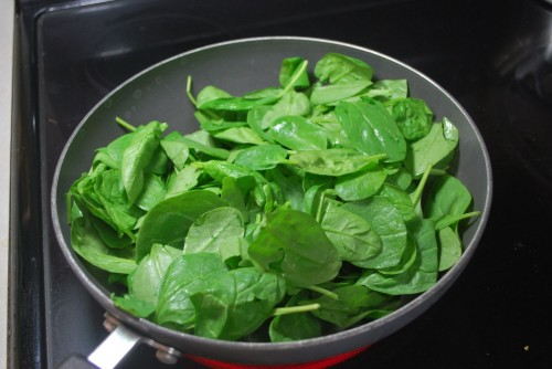 The greens will be overflowing for about 10 seconds, but they cook down quick.