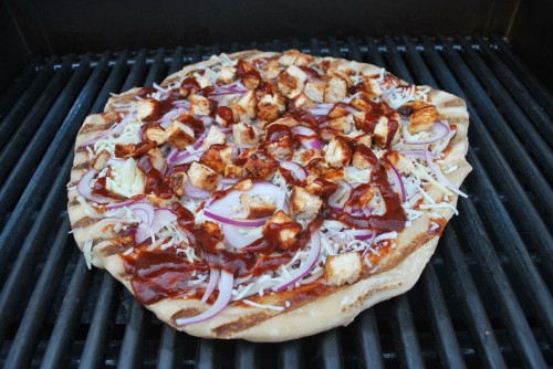 Slide the pizza back onto the grill.  Make sure your heat is set to low.