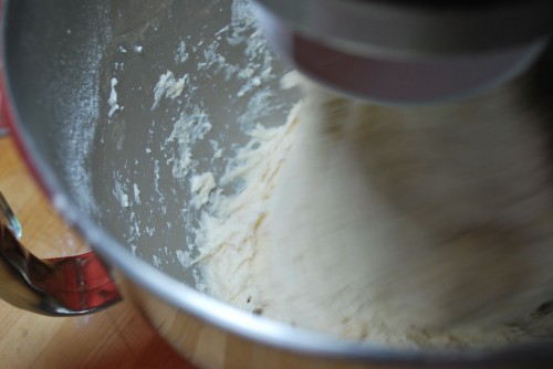Don't worry, it is a wet dough and will stick until you crank the machine up a notch.