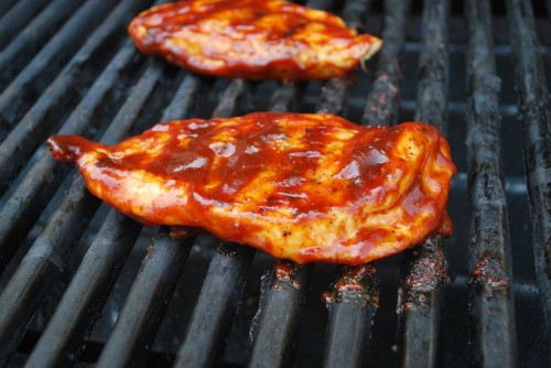 Coating, flipping and grilling will secure the sauce to the chicken