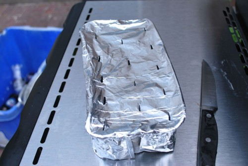Add holes to the foil to allow the smoke to escape.
