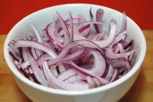 Thinly slice the onions so that they can cook quickly