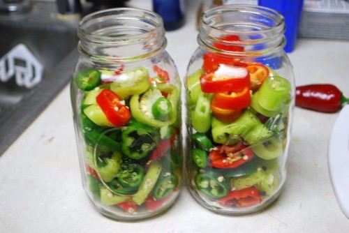 Place the peppers in the jars almost to the top.