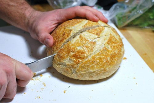Cut 90% of the way through the bread, don't cut all the way through