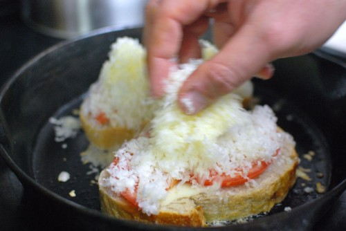 Top the bread with the shredded cheese after it is in the skillet