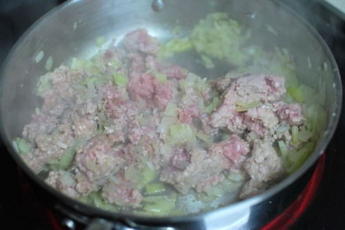 Add the veal.  Break it up and cook until no longer pink.