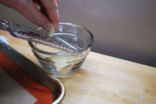 Grating the garlic is the simplest way to finely shred the garlic clove