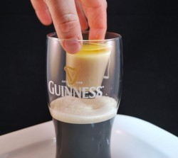 Drop the shot into the pint glass