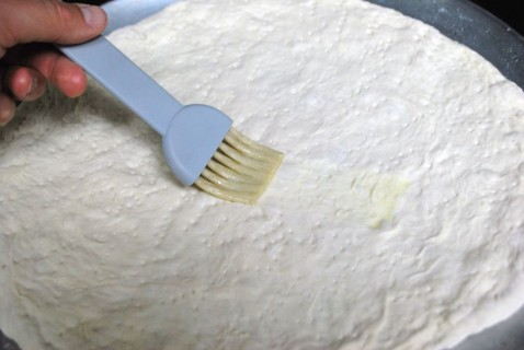 Brush the dough with butter