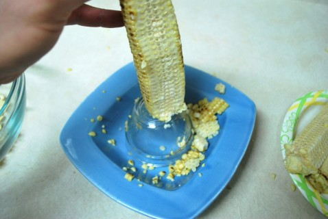 Cut the kernels off of the ear of corn