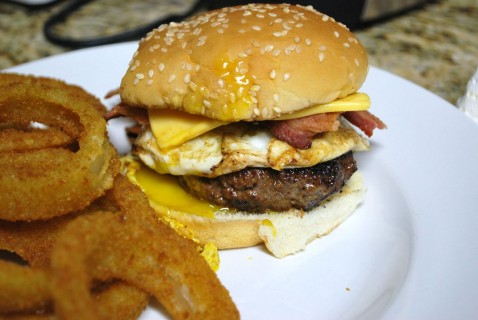 Bacon egg and cheeseburger with onion rings