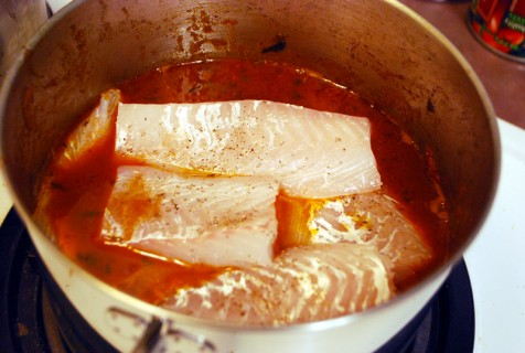 Gently place the fish into the stew