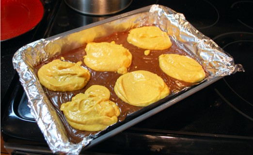 Place the pumpkin into the pan in dollops