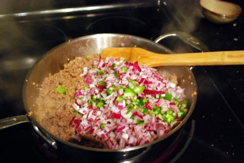 Add the onions and peppers to the mixture