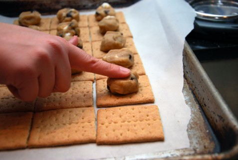 Line up the graham crackers and top with 1 tbs of the dough