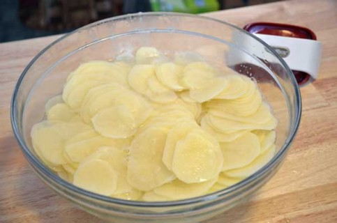 Slice the potatoes