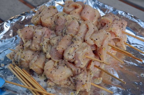 A pile of skewered chicken