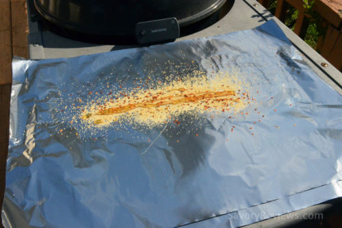 Start by placing the first layer of seasoning on the foil